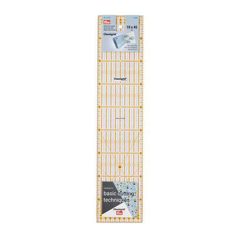 Metric Omnigrid 10 × 45 cm ruler for cutting strips and borders, clear acrylic with yellow grid for quilting and sewing accuracy.